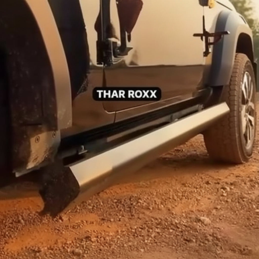 Side step of a vehicle with 'THAR ROXX' branding on a dirt road.