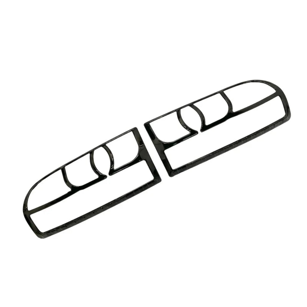 A pair of black taillight covers for Eeco, shown on a white background.