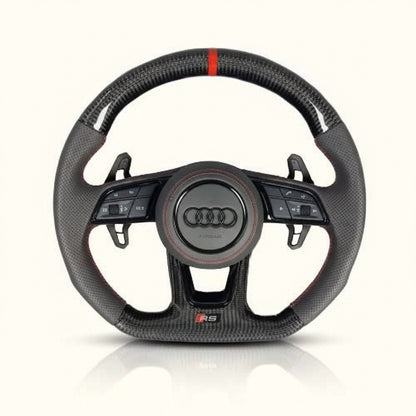 Carbon fiber steering wheel with Audi logo on a white background