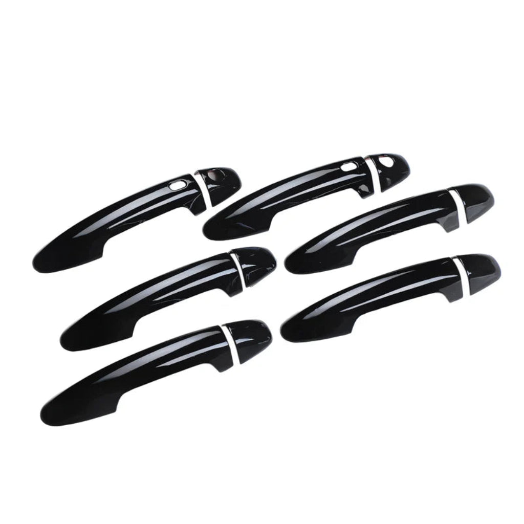 Set of black door handle covers for Fortuner, displayed on a white background. 