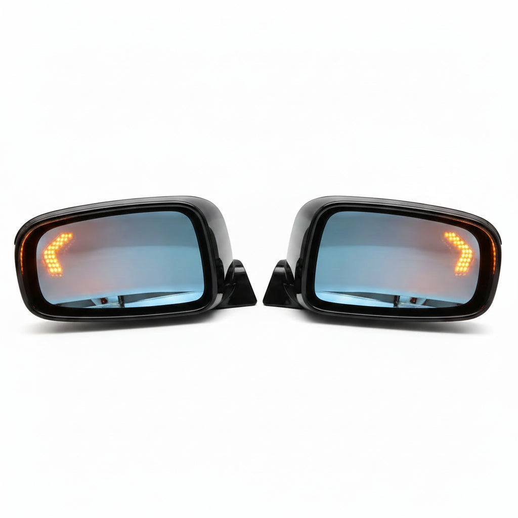 Two car side mirrors with turn signal lights on a white background