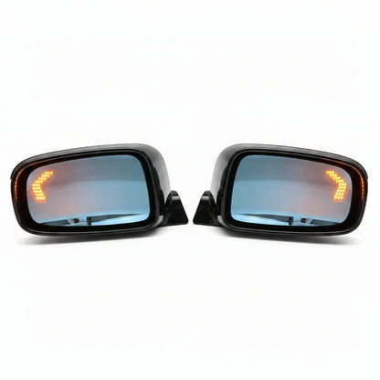 Two car side mirrors with turn signal lights on a white background