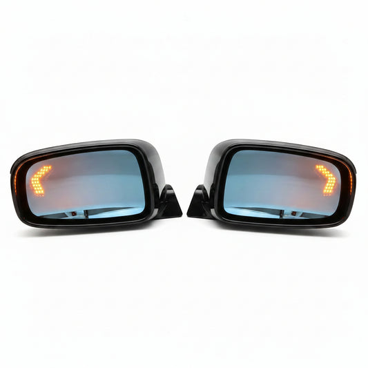 Two car side mirrors with turn signal lights on a white background