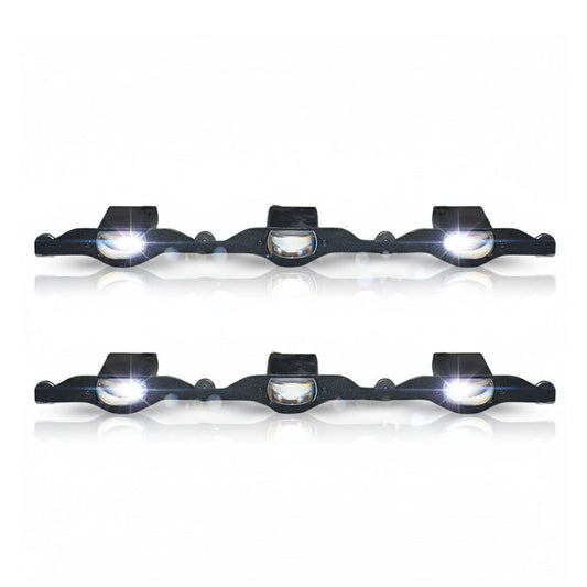 Set of four black bike lights with white lenses on a white background