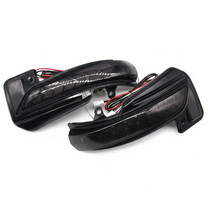 Two black car mirrors on a white background