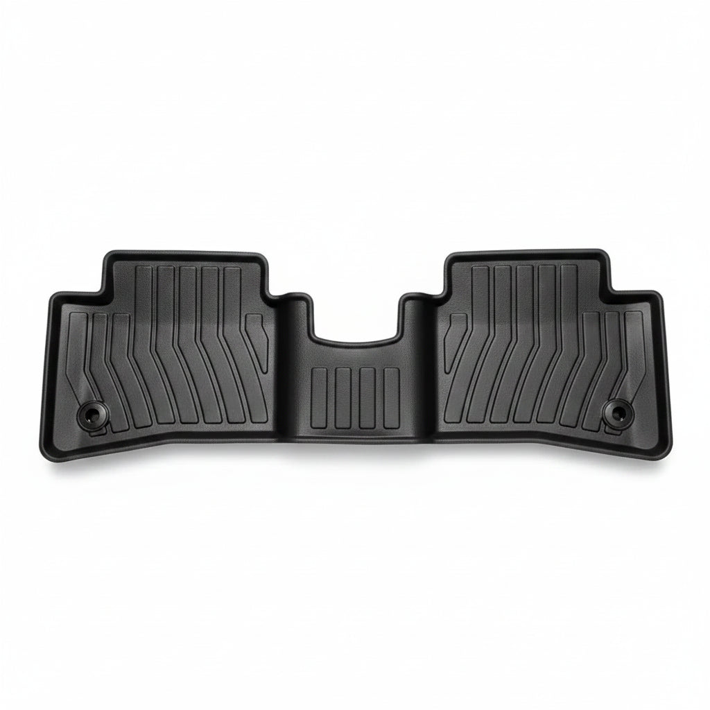 Black car floor mat with textured design on a white background