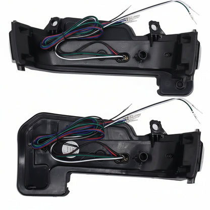 Two car ORVM indicator assemblies with wiring on a white background