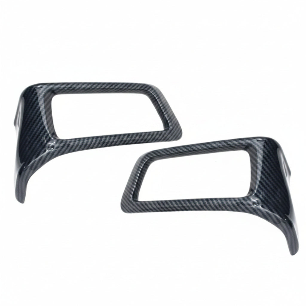 Two carbon fibre AC vents for Hycross on a white background