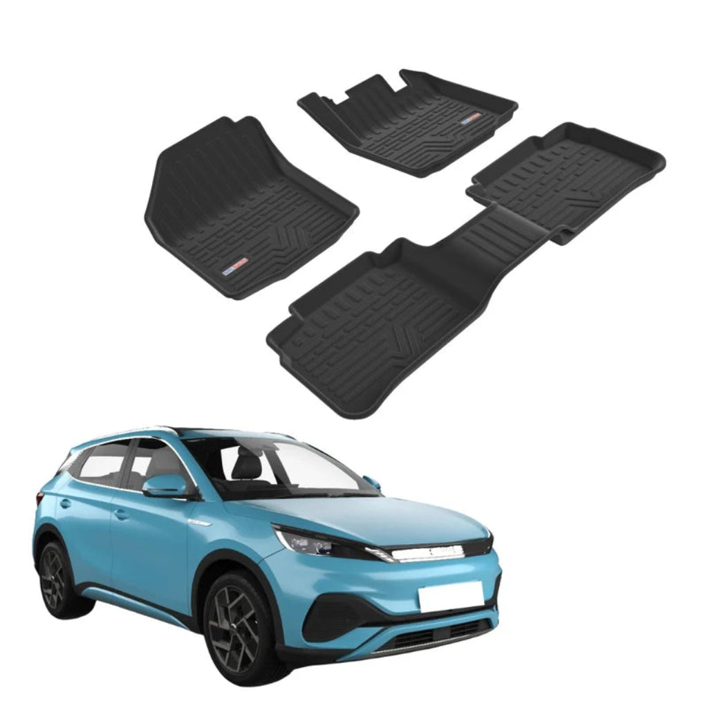 Four black rubber car floor mats are shown on a white background, with a light blue compact SUV used as a size/fit reference. 