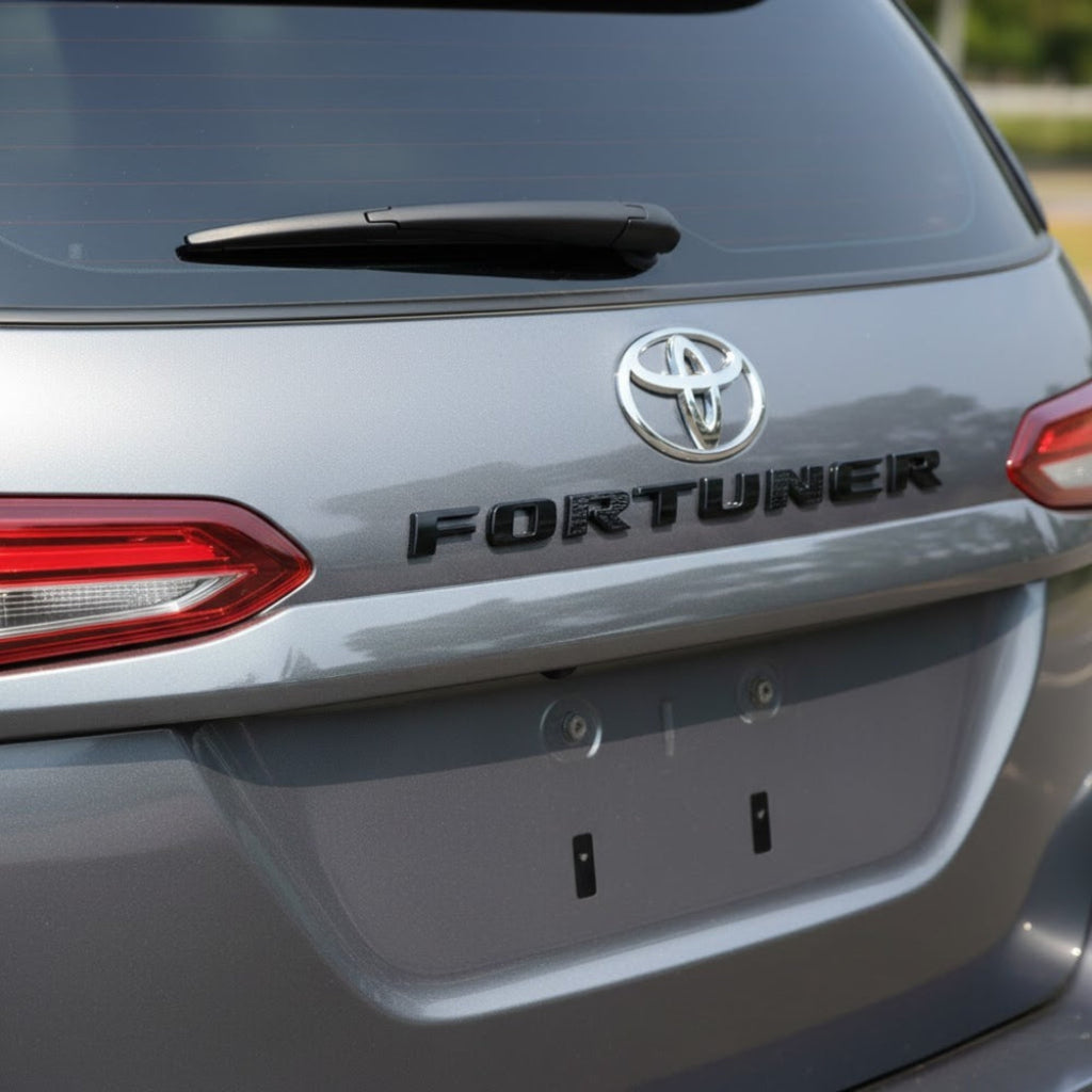 FORTUNER badge in black on a grey fotuner car
