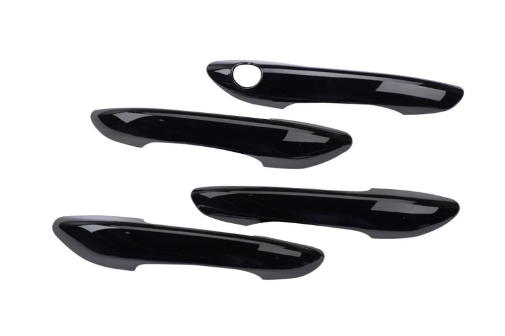 Set of 4 black appliqués for door handle covers for I20 Nios, shown on a plain white background.