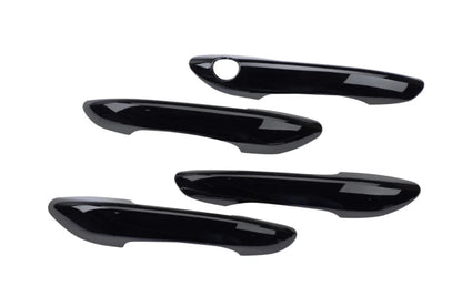 Set of 4 black appliqués for door handle covers for I20 Nios, shown on a plain white background.