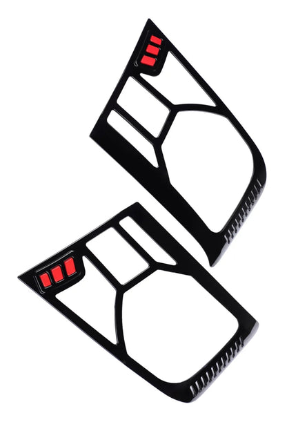 A Pair of Black Headlight Cover with red accents for a Bolero on a white background.