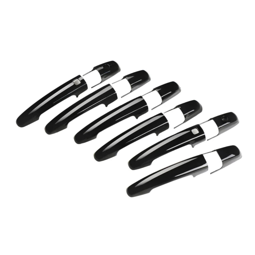 Black set of door handle cover for Dzire, displayed on a white background.