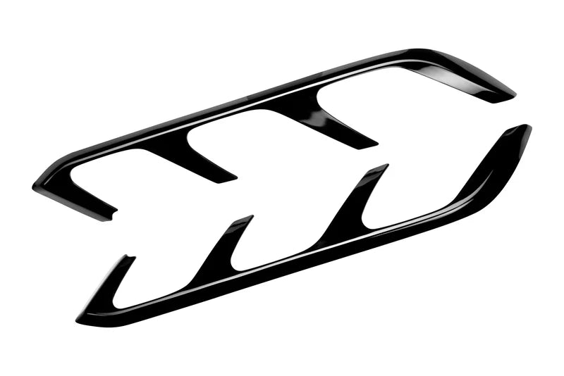 Black car headlight cover on a white background