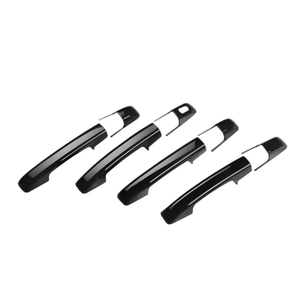 Set of 4 black door handle covers for Magnite, displayed on a white background. 