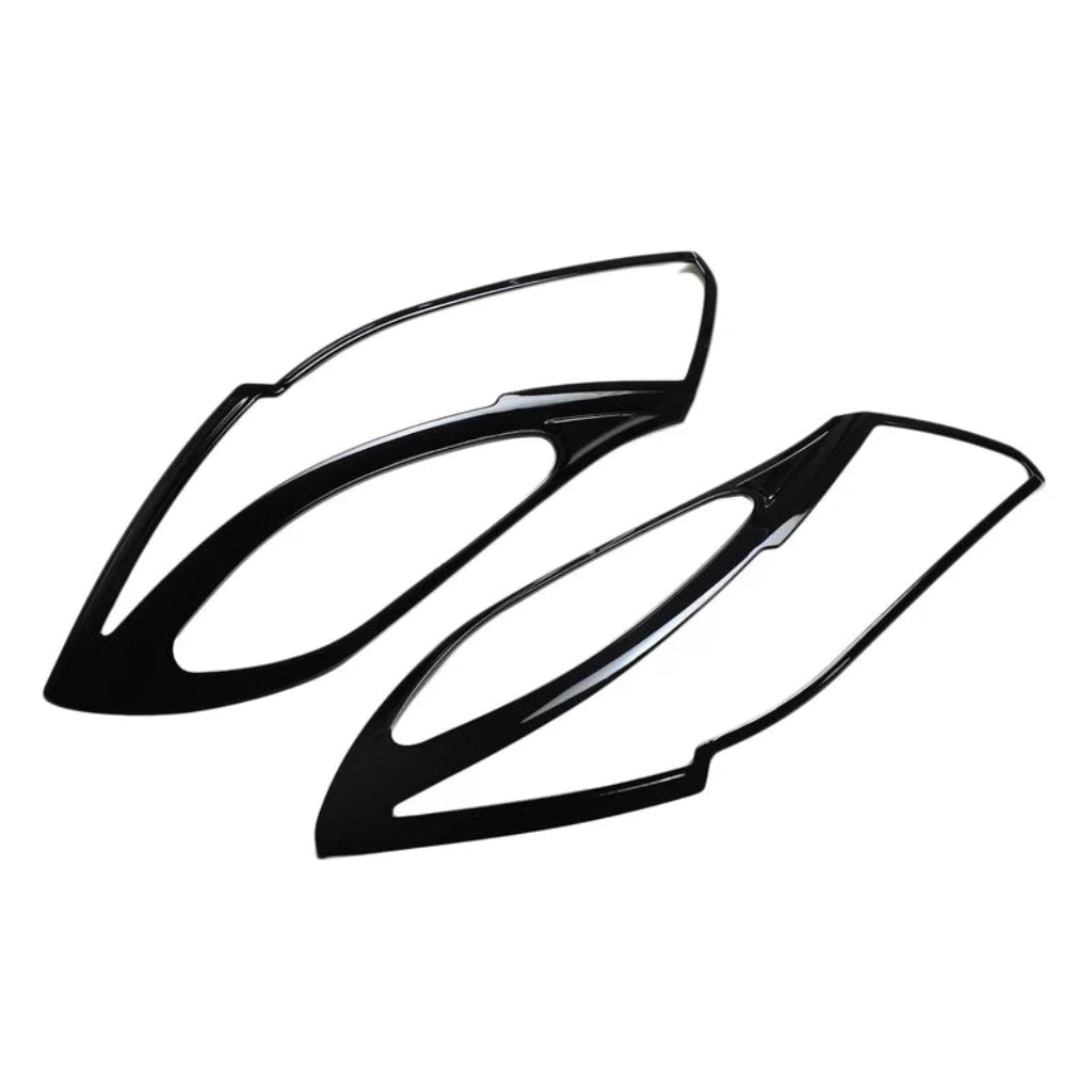 Set of 2 pcs black headlight covers for Nexon, displayed on a white background. 
