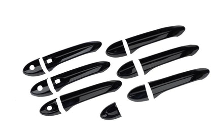 Set of black door handle covers for Nexon, displayed on a white background. 