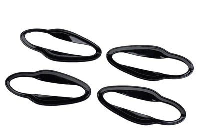 Set of 4 black catch covers for Nexon, displayed on a white background.