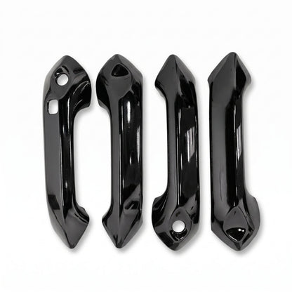 Set of 4 black door handle covers for Punch, displayed on a white background. 