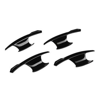Set of 4 black catch covers for Seltos, displayed on a white background. 