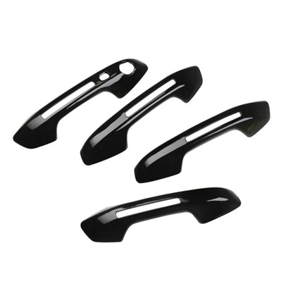 Set of 4 black door handle covers for Seltos, displayed on a white background. 