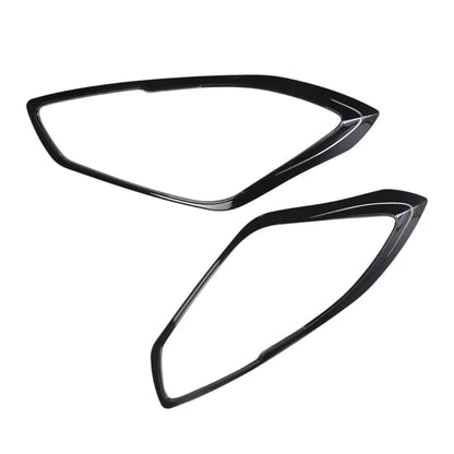 Set of 2 Black headlight cover for Swift placed on a white background.