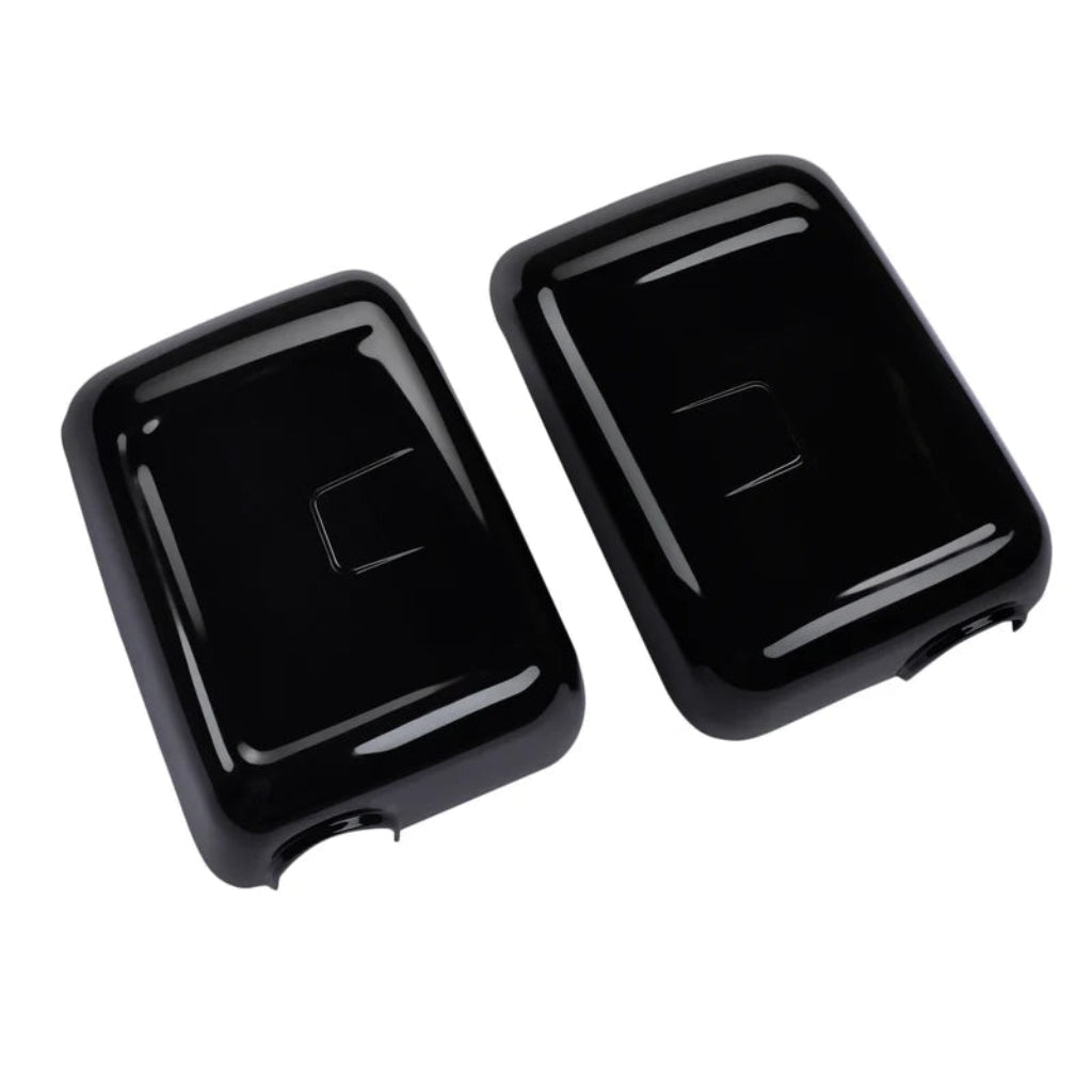 A pair of black color ORVM Covers for Bolero on a clear white background. 