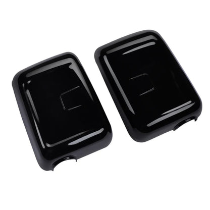 A pair of black color ORVM Covers for Bolero on a clear white background. 