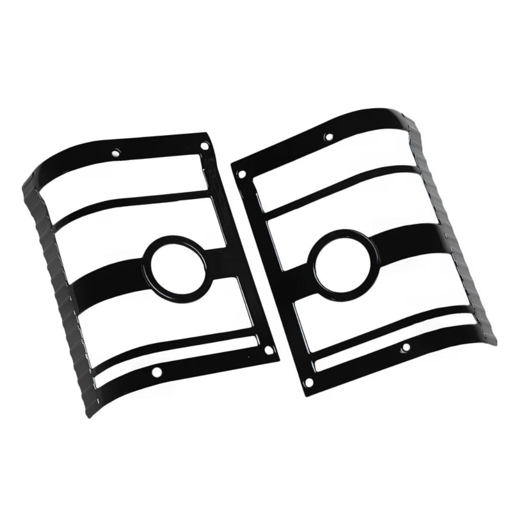 A pair of black taillight cover for Bolero on a clear white background. 
