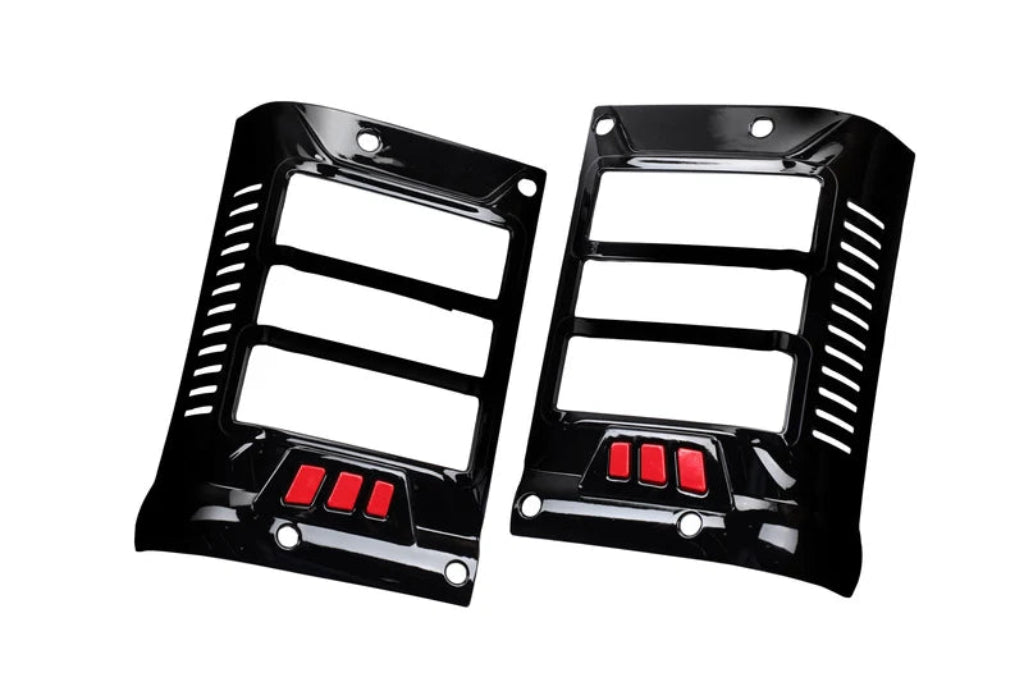 A pair of glossy black Taillight covers for Bolero with red accents, displayed on a clean white background.