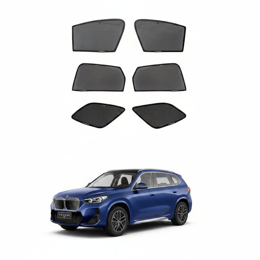 Set of car window sunshades for BMW X1 LWB with a blue SUV in the background