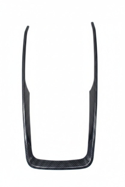 Carbon fiber trim piece on a white background