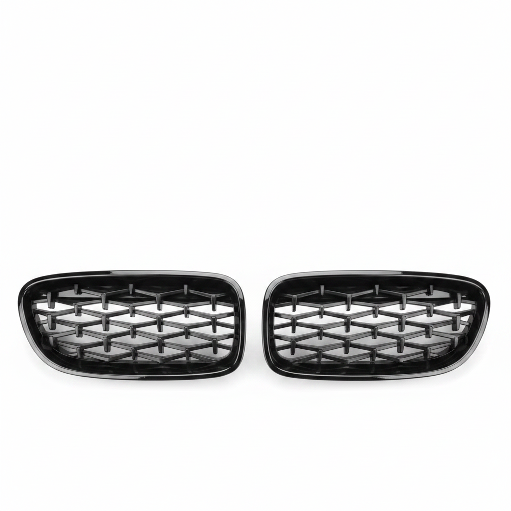 Pair of black car grills on a white background