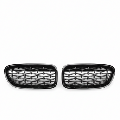 Pair of black car grills on a white background