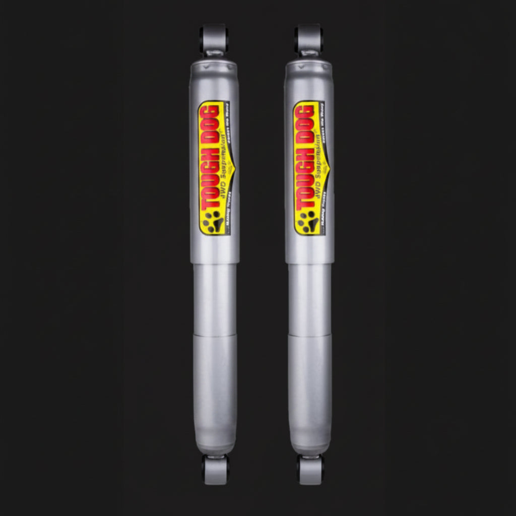 Two Tough Dog shock absorbers on a black background