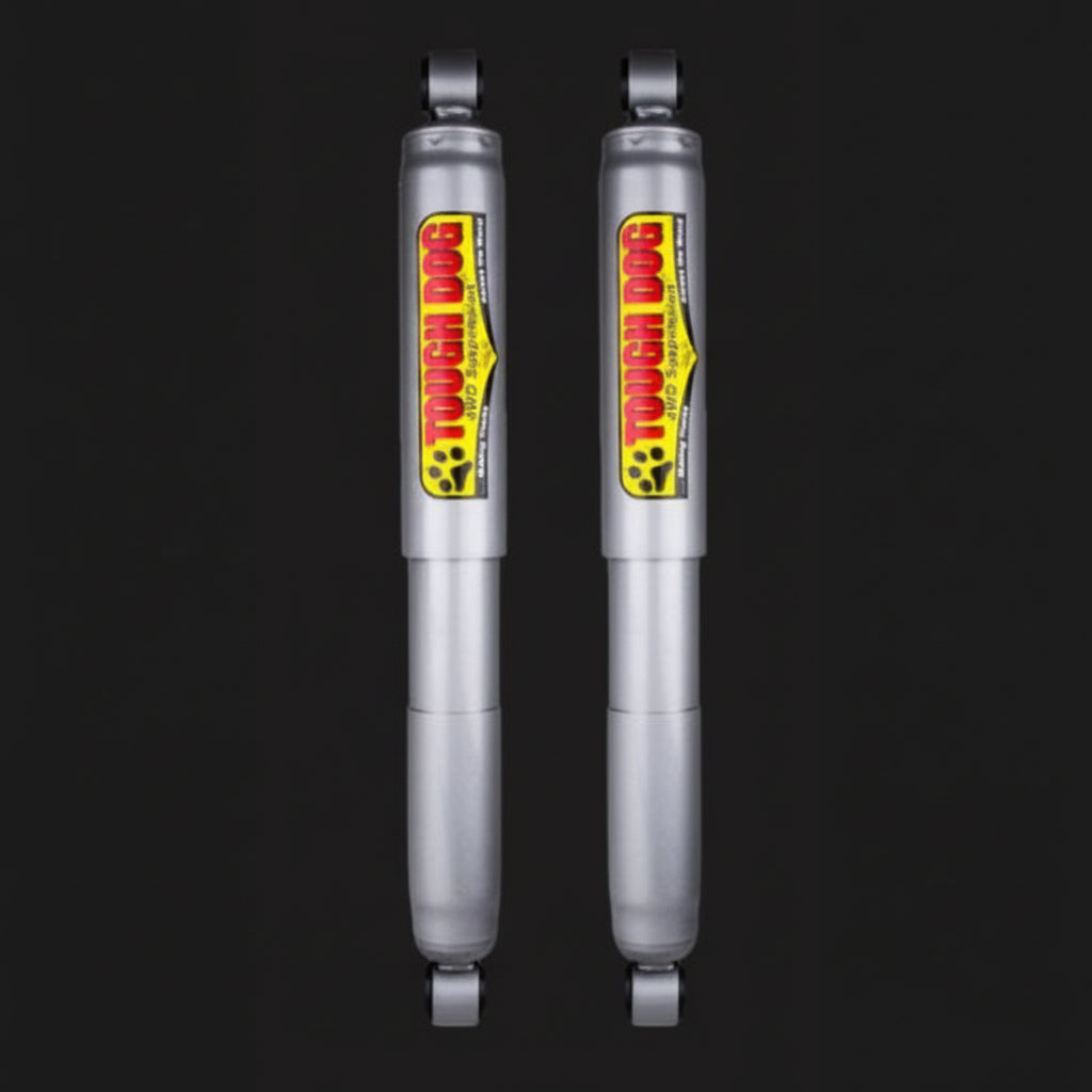 Two Tough Dog shock absorbers on a black background