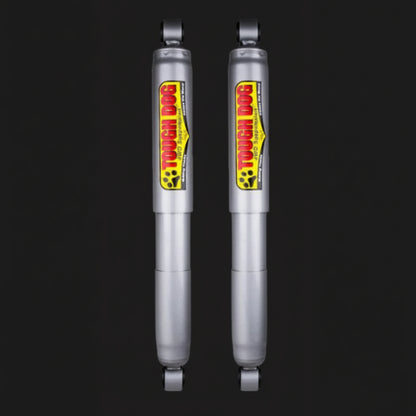 Two Tough Dog shock absorbers on a black background