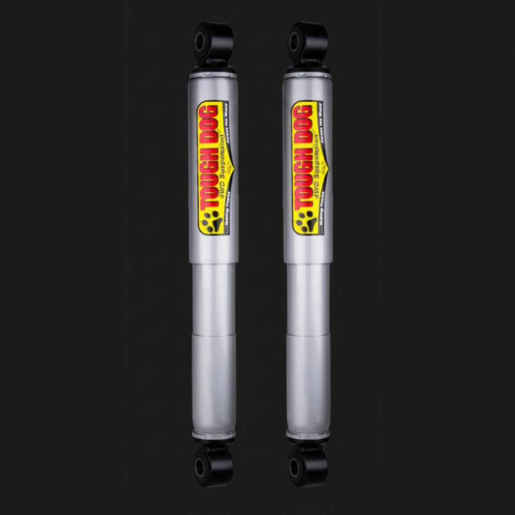 Two Tough Dog shock absorbers on a black background
