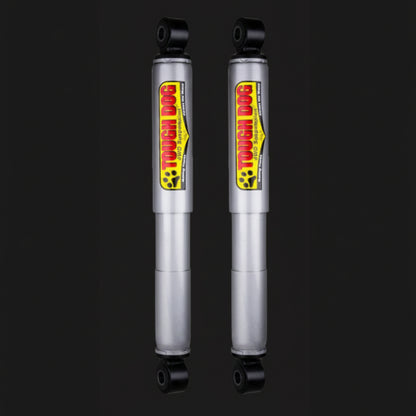 Two Tough Dog shock absorbers on a black background