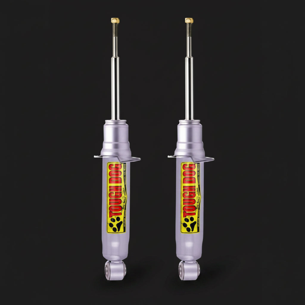 Two shock absorbers with a brand logo on a black background