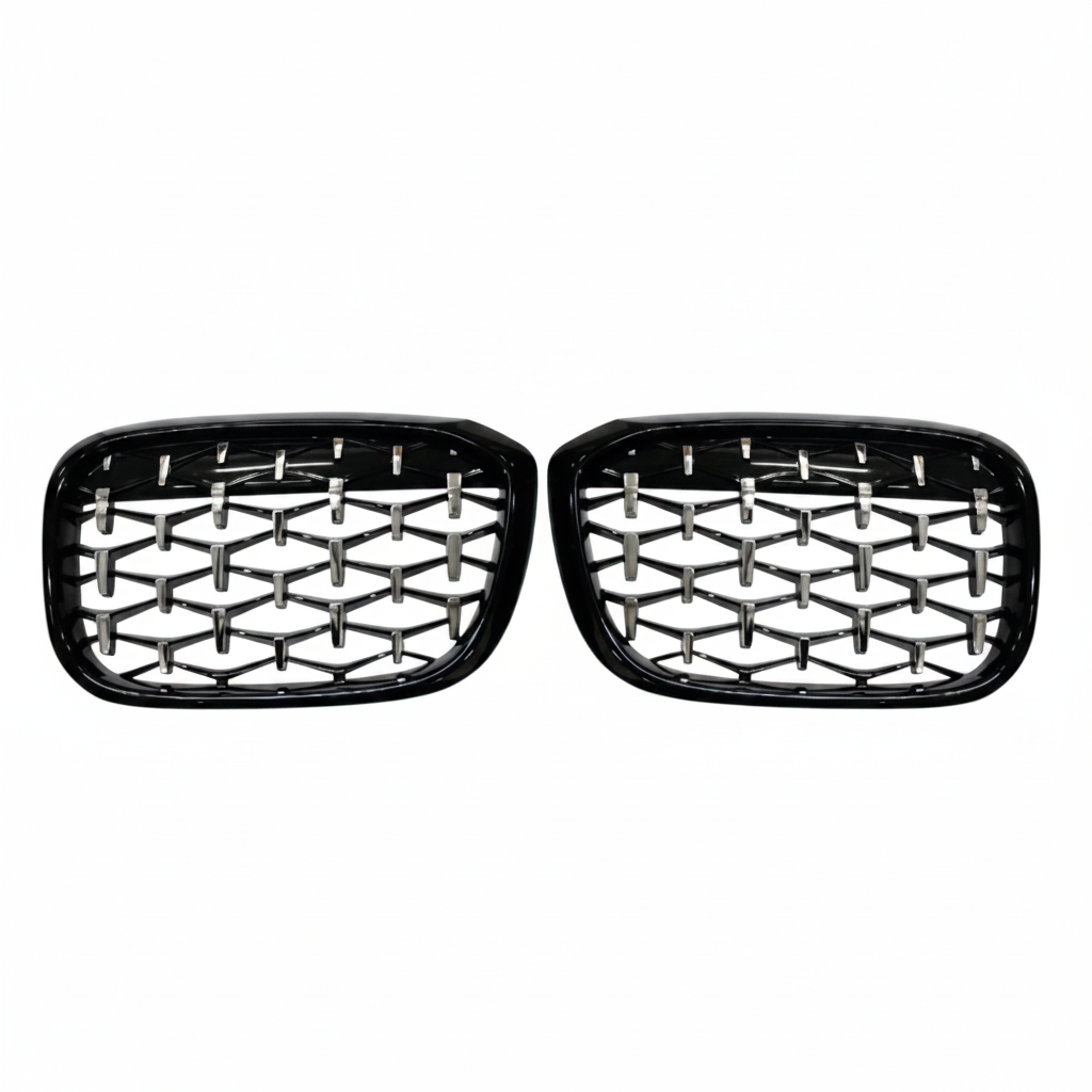 Pair of black car grills with honeycomb design on a white background