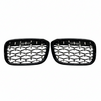 Pair of black car grills with honeycomb design on a white background