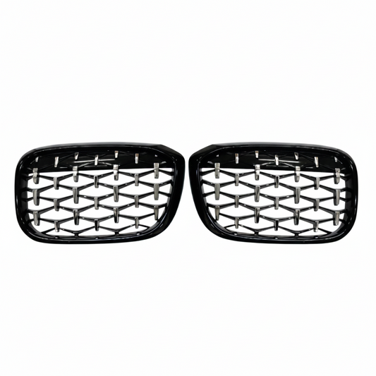 Pair of black car grills with honeycomb design on a white background