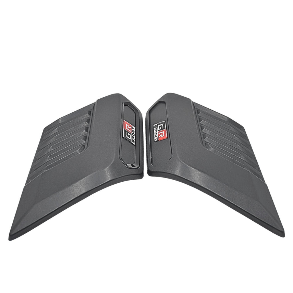 Pair of black car bonnet scoops with a brand logo on a white background