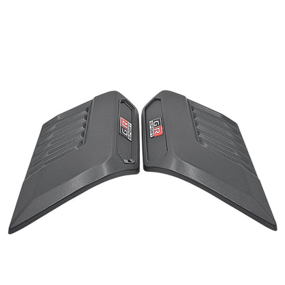 Pair of black car bonnet scoops with a brand logo on a white background