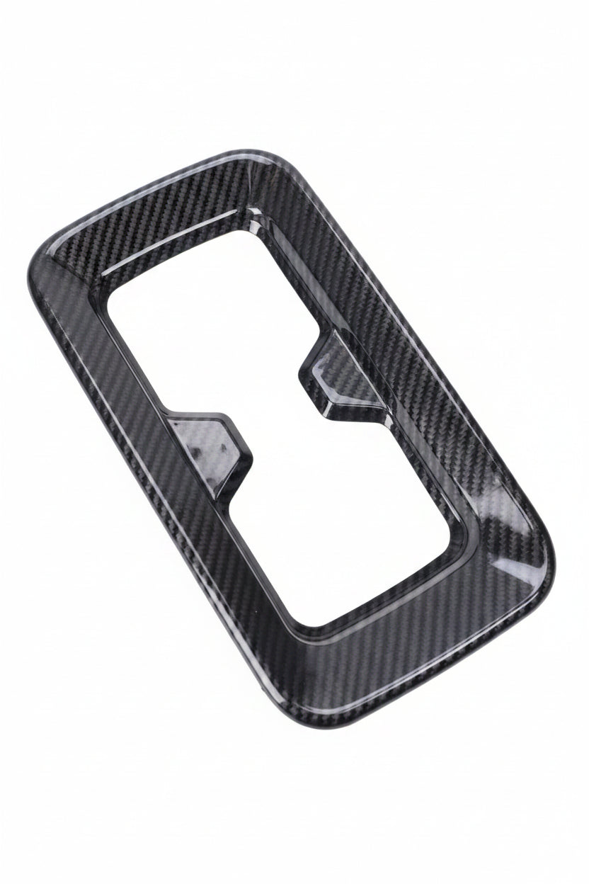 Carbon fiber patterned car interior trim on a white background