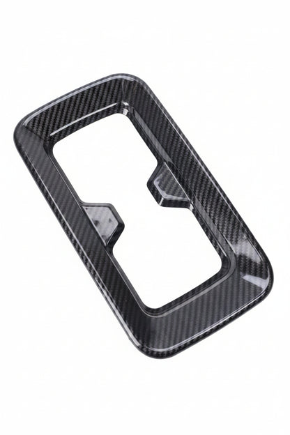 Carbon fiber patterned car interior trim on a white background