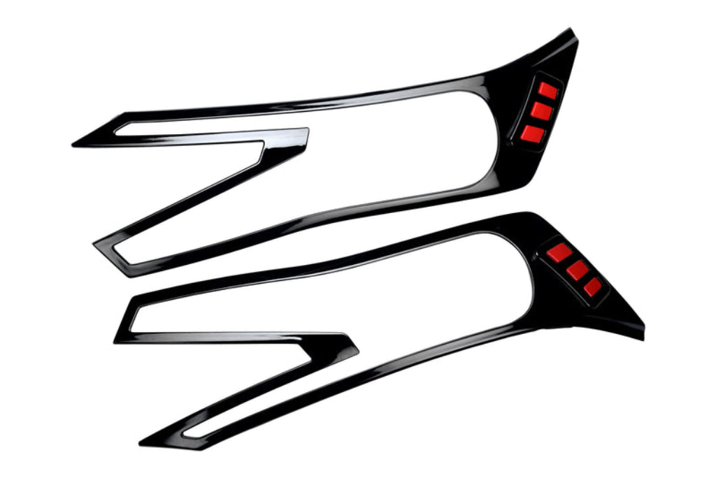 Set of 2 pcs black headlight covers for Brezza, displayed on a white background. 