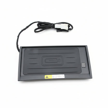Black electronic device with a power cable on a white background